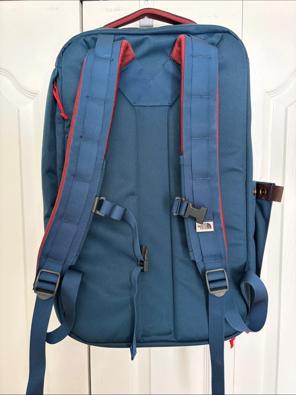 The North Face Travel Duffel Blue Backpack with Red Accents